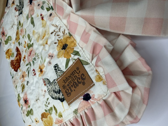 Close-up of quilted cotton journal cover showing hen and floral print with blush gingham ruffle — Bible covers, journal covers, handmade unique gifts
