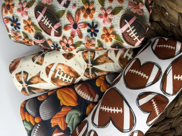 Photographed fall fabric rolls in autumn and football prints